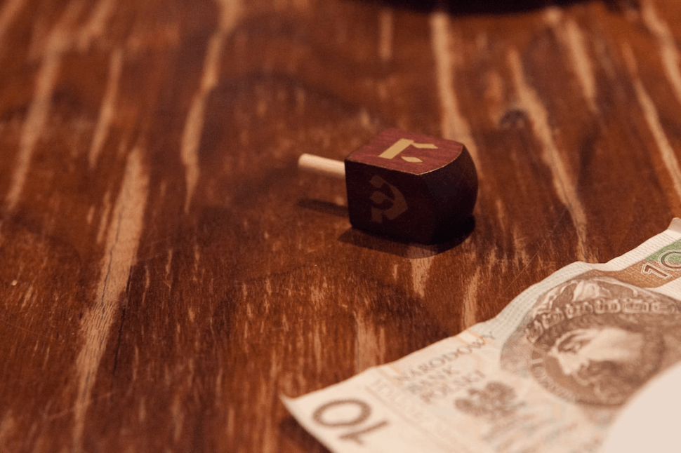 Dreidel is a spinning top that has four sides. These spinning tops have four sides.